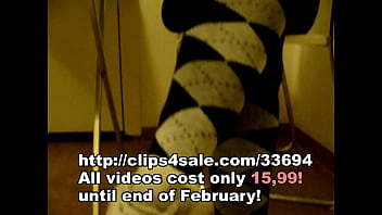 Cute girl removes her shoes after sweaty socks and soles