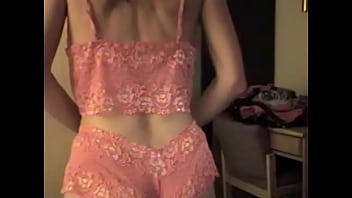 Donna trying on a new outfit before sex