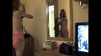 Donna trying on a new outfit before sex