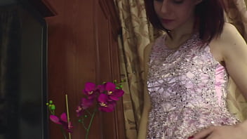 Redhead cutie in white stockings strips her clothes