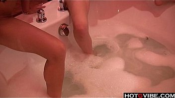 Hotties having fun together in a hot tub