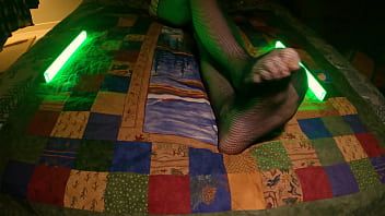 Sensual perfect feet peek through fishnet pantyhose