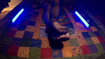 Sensual perfect feet peek through fishnet pantyhose