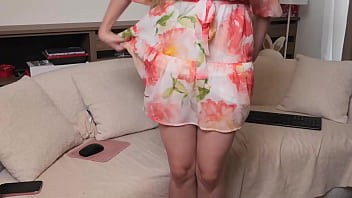 Playful blonde dancing in a dress