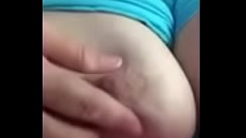 Wife playing with tit for husband