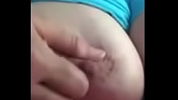 Wife playing with tit for husband