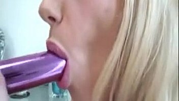 Blonde whore masturbating with a vibrator
