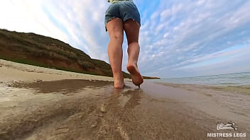 Barefoot walks over the summer seashore Barefoot walks over the summer seashore