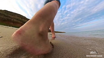 Barefoot walks over the summer seashore Barefoot walks over the summer seashore