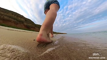 Barefoot walks over the summer seashore