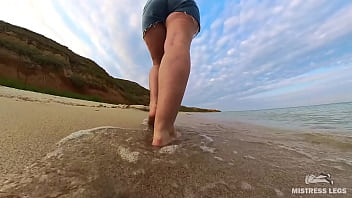 Barefoot walks over the summer seashore
