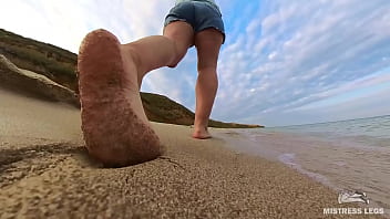 Barefoot walks over the summer seashore
