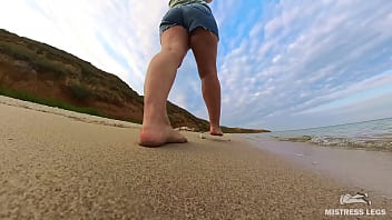 Barefoot walks over the summer seashore Barefoot walks over the summer seashore