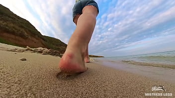 Barefoot walks over the summer seashore