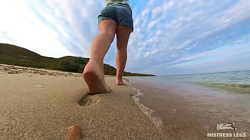 Barefoot walks over the summer seashore Barefoot walks over the summer seashore