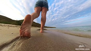 Barefoot walks over the summer seashore