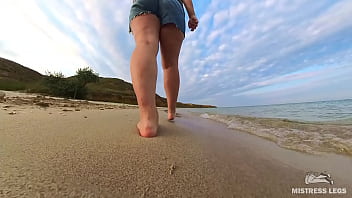 Barefoot walks over the summer seashore Barefoot walks over the summer seashore