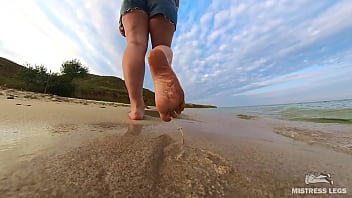 Barefoot walks over the summer seashore Barefoot walks over the summer seashore