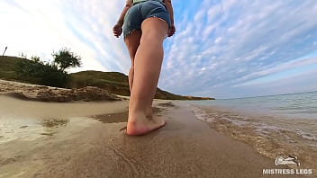 Barefoot walks over the summer seashore Barefoot walks over the summer seashore