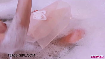 Stunning teen model enjoys a sensual bath