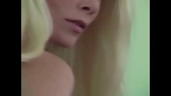 Blonde whore fingers her twat and gets off laying in sofa