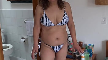 Stepmom shows off on the beach very excited and masturbates