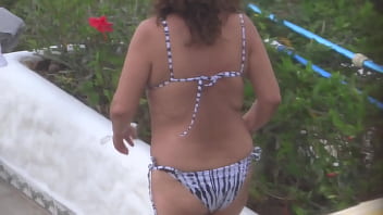 Stepmom shows off on the beach very excited and masturbates