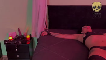 Dominatrix in intense session with her new submissive