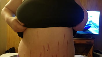 Pulling her boobs out