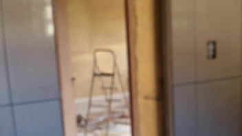 In the bathroom with the construction worker