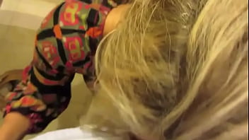 Sucking cock in a bathroom at a hotel lobby