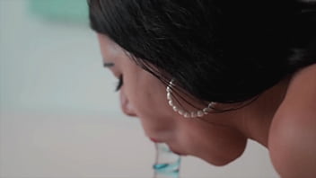 Latina slut shows photographer how she sucks glass cock