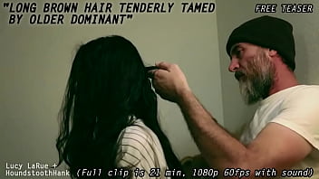 Long brown hair tenderly tamed by older dominant