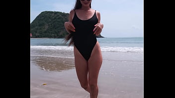 Black bikini and passionate flashing on the beach