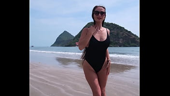 Black bikini and passionate flashing on the beach