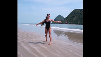 Black bikini and passionate flashing on the beach