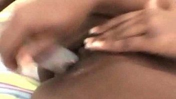 Ebony babe masturbating her pussy with dildo