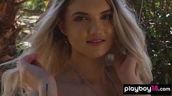 Cute faced blonde babe posing naked in the pool outdoor