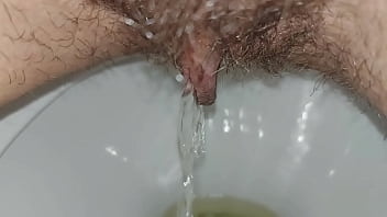 Hairy pussy pissing close up