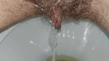 Hairy pussy pissing close up