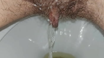 Hairy pussy pissing close up