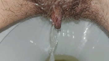 Hairy pussy pissing close up