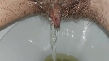 Hairy pussy pissing close up
