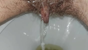 Hairy pussy pissing close up