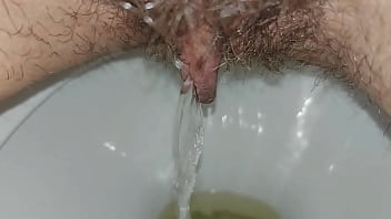 Hairy pussy pissing close up