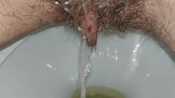 Hairy pussy pissing close up