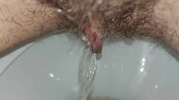 Hairy pussy pissing close up