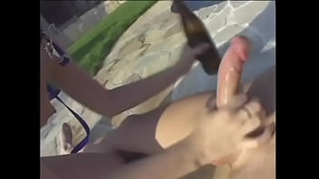 Young blonde masturbates on an inflatable mattress in the pool