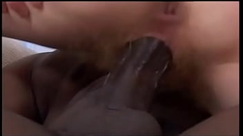 Curly haired babe gets an ebony and ivory fuck