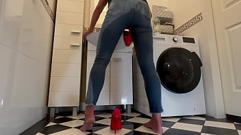 Wetting extremely jeans and red classic high heels and play with pee